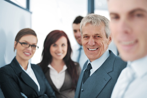 Small business team in the office in front of a whiteboard