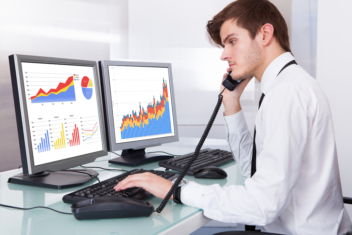 Stock Broker Working At Office